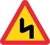 A2-1, Varning för flera farliga kurvor, första mot vänster